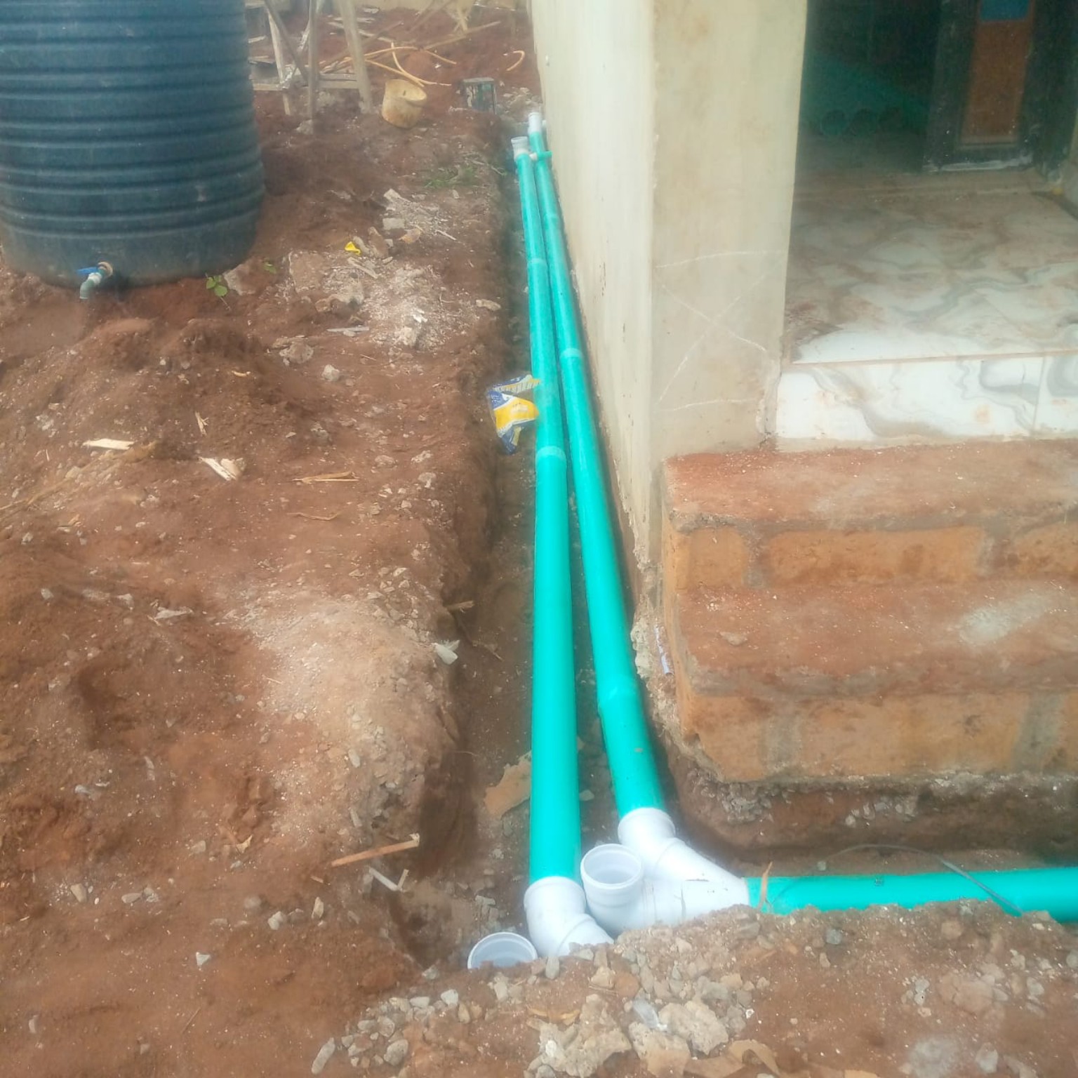 Pipe installation beside a building